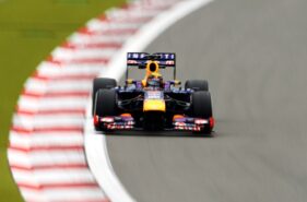Sebastian Vettel racing his Red Bull RB9