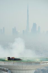 David Coulthard doing burnouts on heli platform with Burj Dubai