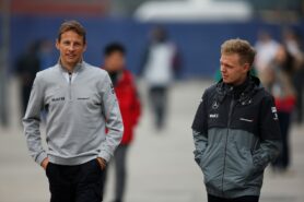 Kevin Magnussen and Jenson Button in the paddock.