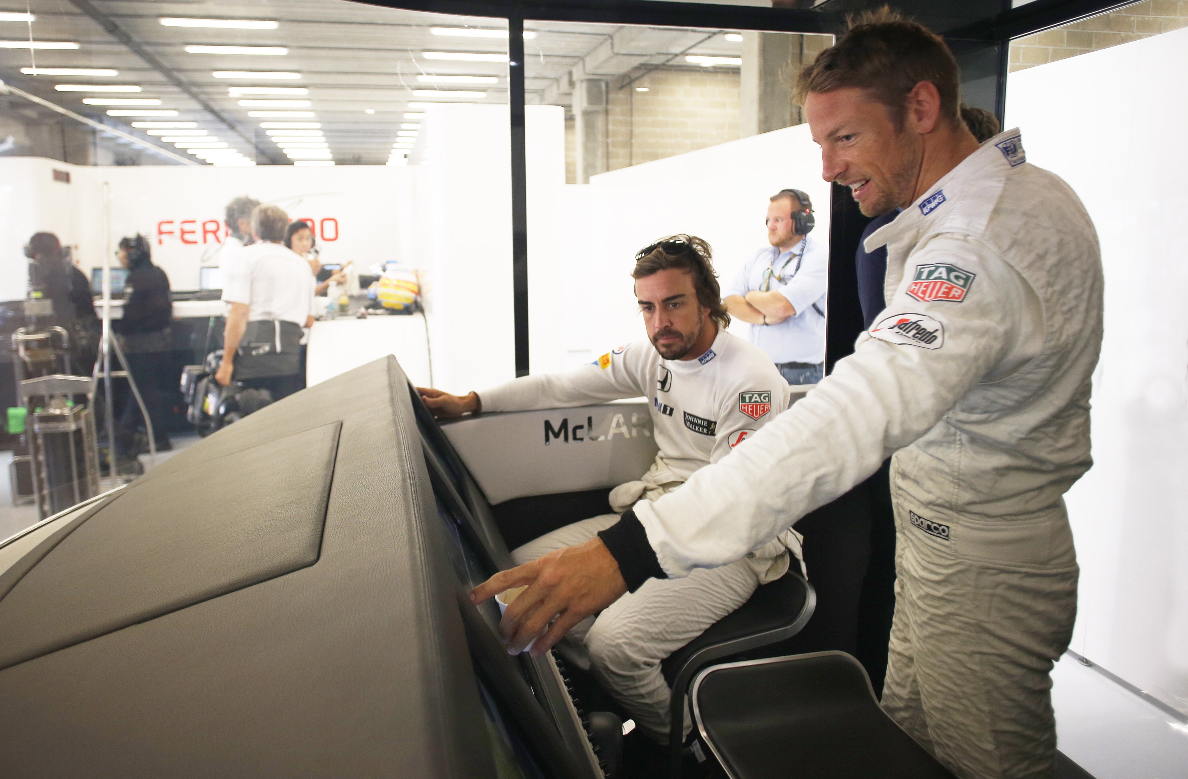 Fernando Alonso and Jenson Button in the garage.