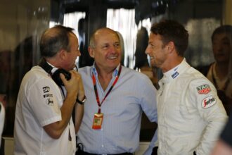 Jonathan Neale, Ron Dennis and Jenson Button in the garage.