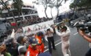 Lewis Hamilton celebrates his Monaco victory with a champagne shower over his team