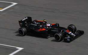 Jenson Button on the circuit in his McLaren MP4-31 Honda (2016)