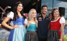Daniel Ricciardo of Australia and Red Bull Racing poses with the Formula Unas girls before final practice for the Formula One Grand Prix of Austria at Red Bull Ring on