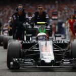 Jenson Button is pushed onto the grid.