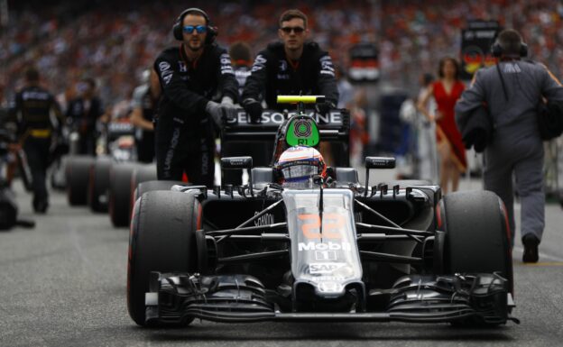 Jenson Button is pushed onto the grid.