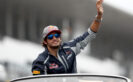 Carlos Sainz waves to the crowd on the drivers parade before the Formula One Grand Prix 2016