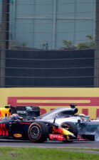 Lewis Hamilton locks a wheel under braking as he tries to overtake Max Verstappen on track during the Formula One Grand Prix of Japan 2016