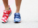 Daniel Ricciardo walks in the Paddock wearing stars and stripes trainers during previews ahead of the United States Formula One Grand Prix 2016.