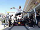 Skateboarder Ryan Sheckler performs a trick in front of the Red Bull Racing team practicing pit stops before final practice for the United States Formula One Grand Prix 2016.