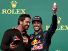 Actor Gerard Butler does a shoey on the podium with Daniel Ricciardo of Australia and Red Bull Racing after Daniel finished third in the race during the United States Formula One Grand Prix 2016.