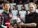 Romain Grosjean-helmet-presentation-to-Gene Haas