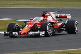 Sebastian Vettel driving the Ferrari SF70H with protection shield.