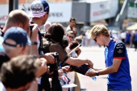 Brendon Hartley of Scuderia Toro Rosso signs autographs for fans in the Pitlane during previews ahead of the Monaco GP 2018.