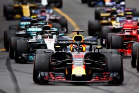 Daniel Ricciardo of Red Bull Racing RB14 TAG Heuer leads the field into turn one at the start during the Monaco Formula One Grand Prix at Circuit de Monaco on May 27, 2018 in Monte-Carlo, Monaco.