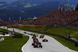 All cars racing from 1st to 2nd corner with Lewis Hamilton on front in the Mercedes