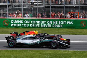 Max Verstappen driving the (33) Aston Martin Red Bull Racing RB14 TAG Heuer and Valtteri Bottas driving the (77) Mercedes AMG Petronas F1 Team Mercedes WO9 battle for track position at the start during the Canadian Formula One Grand Prix at Circuit Gilles Villeneuve on June 10, 2018 in Montreal, Canada.