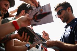 Daniel Ricciardo of Red Bull Racing signs autographs for fans in the Pitlane during previews ahead of the Formula One Grand Prix of France at Circuit Paul Ricard on June 21, 2018 in Le Castellet, France.