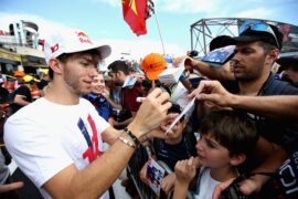 Pierre Gasly of Scuderia Toro Rosso signs autographs for fans during previews ahead of the Formula One Grand Prix of France at Circuit Paul Ricard on June 21, 2018 in Le Castellet, France.