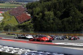 Kimi Raikkonen (Ferrari) going wide in turn 2 of lap 2 with the rest of the grid behind him.