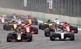 Max Verstappen leads Lewis Hamilton and the rest of the field into turn one at the start during the Formula One Grand Prix of Mexico at Autodromo Hermanos Rodriguez on October 28, 2018 in Mexico City, Mexico.