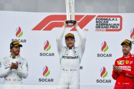 Valtteri Bottas on the podium on P1, with trophy