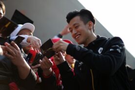 Guanyu Zhou (CHN) Renault F1 Team Test and Development Driver signs autographs for the fans. Chinese Grand Prix, Thursday 11th April 2019. Shanghai, China.
