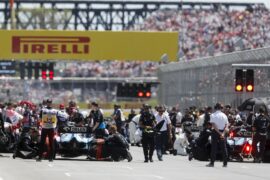 Mechanics clear the grid prior to the start of the formation lap during the Canadian GP at Circuit Gilles-Villeneuve on June 09, 2019 in Circuit Gilles-Villeneuve, Canada.