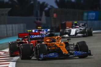 Carlos Sainz, McLaren MCL35, leads Charles Leclerc, Ferrari SF1000